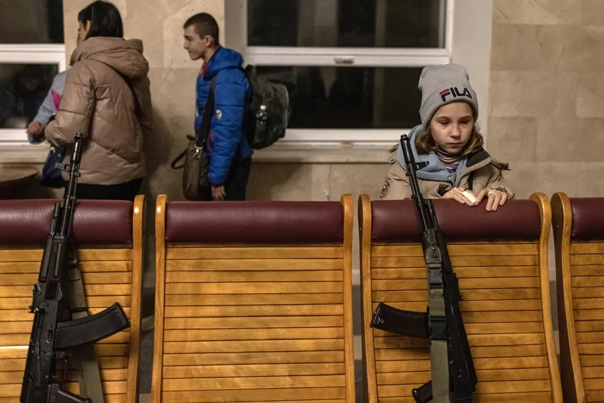 A girl waiting to board an evacuation train to Kyiv at Kherson’s railway station. Photo: Roman Pilipey / EPA-EFE