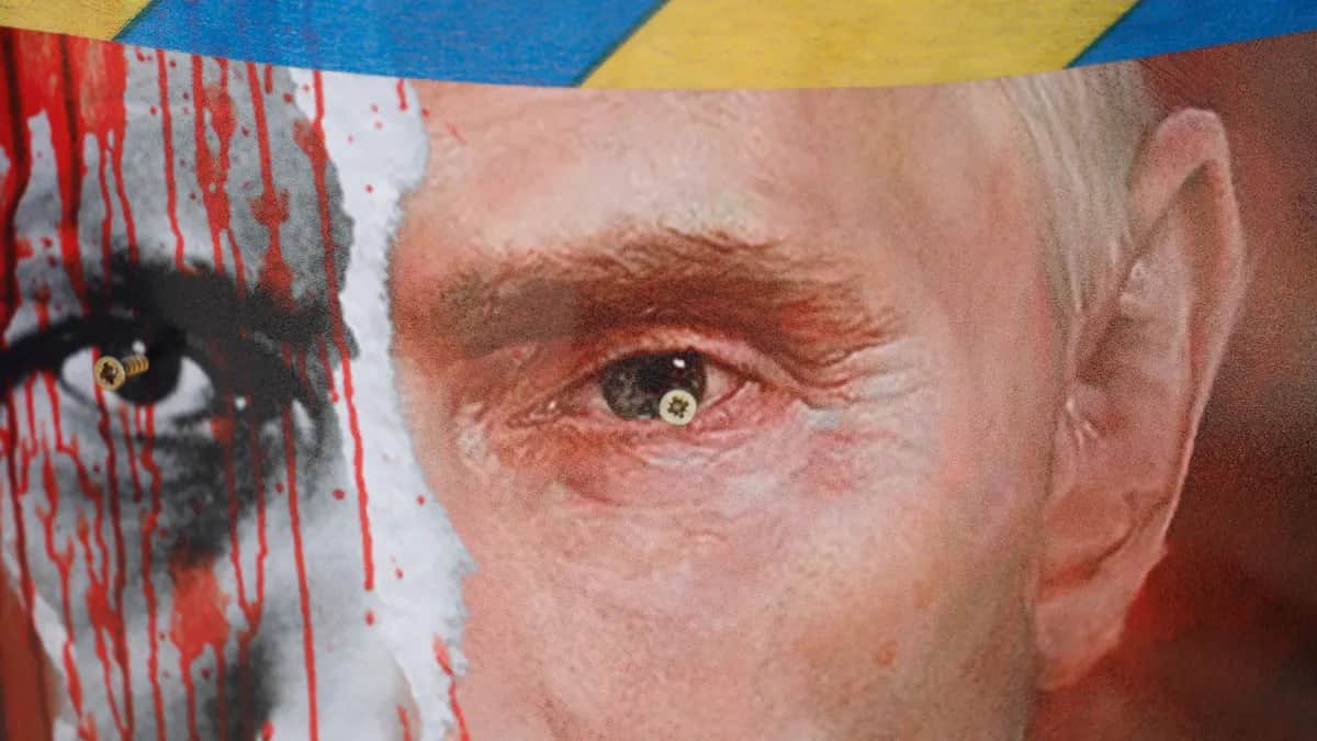 A poster with Russian President Vladimir Putin is displayed during a protest in front of the Russian Embassy in Riga, Latvia, 17 March 2022.&nbsp;Photo: EPA-EFE/TOMS KALNINS