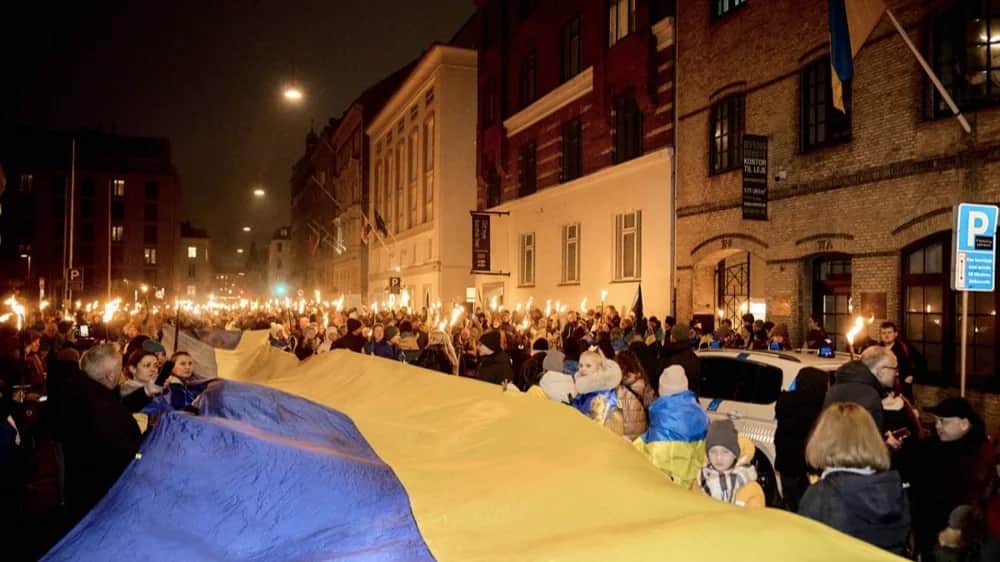 People carry a giant Ukrainian flag through the streets of Copenhagen <span id="fcue6u2zo">during a solidarity rally on the fourth anniversary of the Russian invasion, </span>24 February 2026. Photo: EPA/THOMAS TRAASDAHL